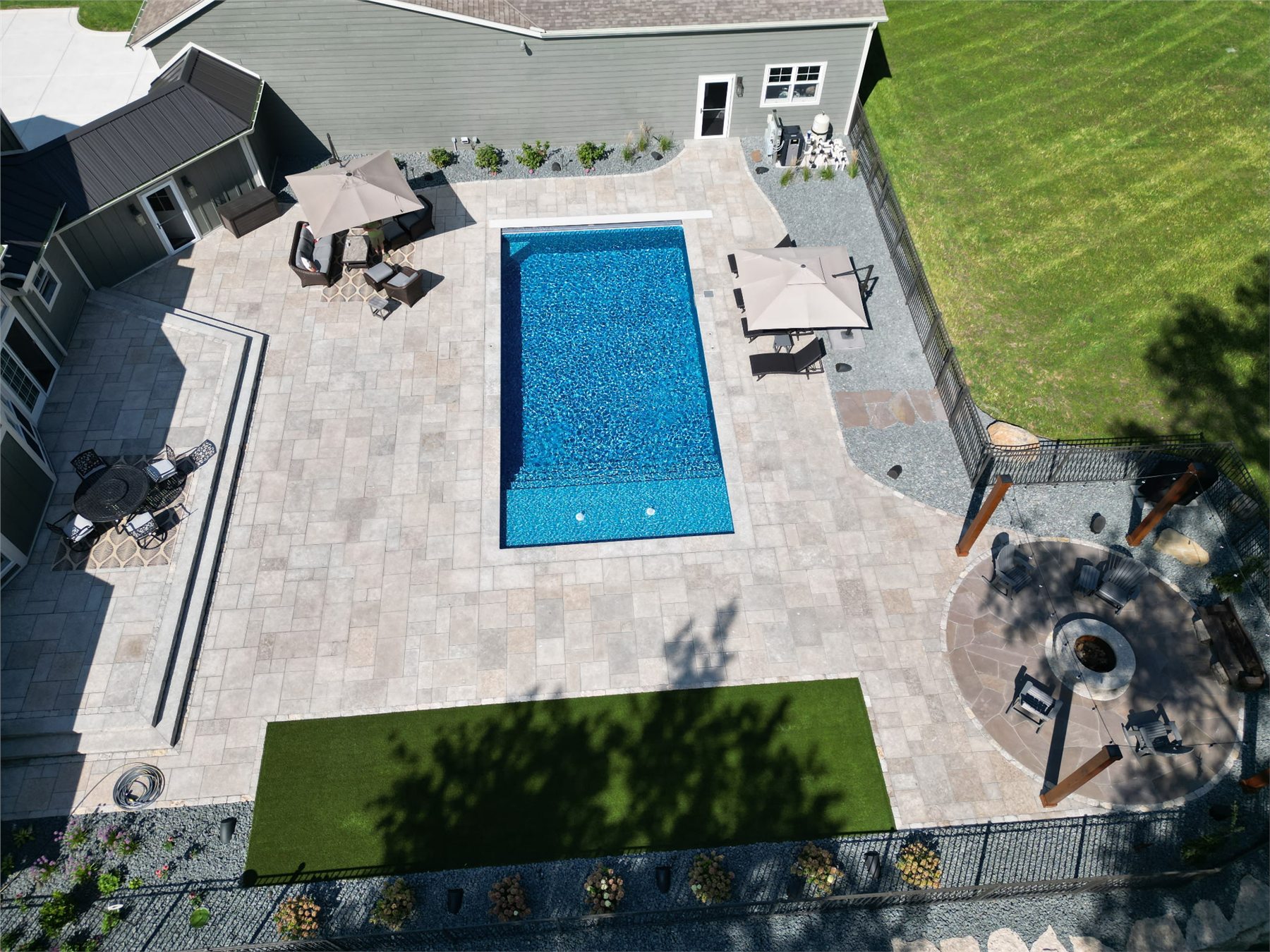 Overhead view of a finished Einstein pool and hardscape
