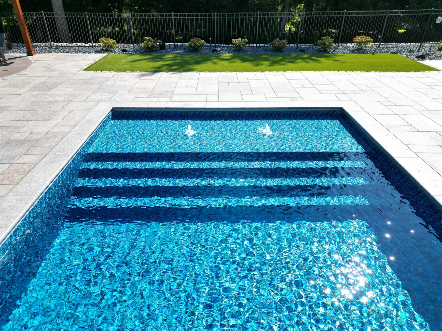 Finished Einstein pool with full-width entry steps and tanning ledge