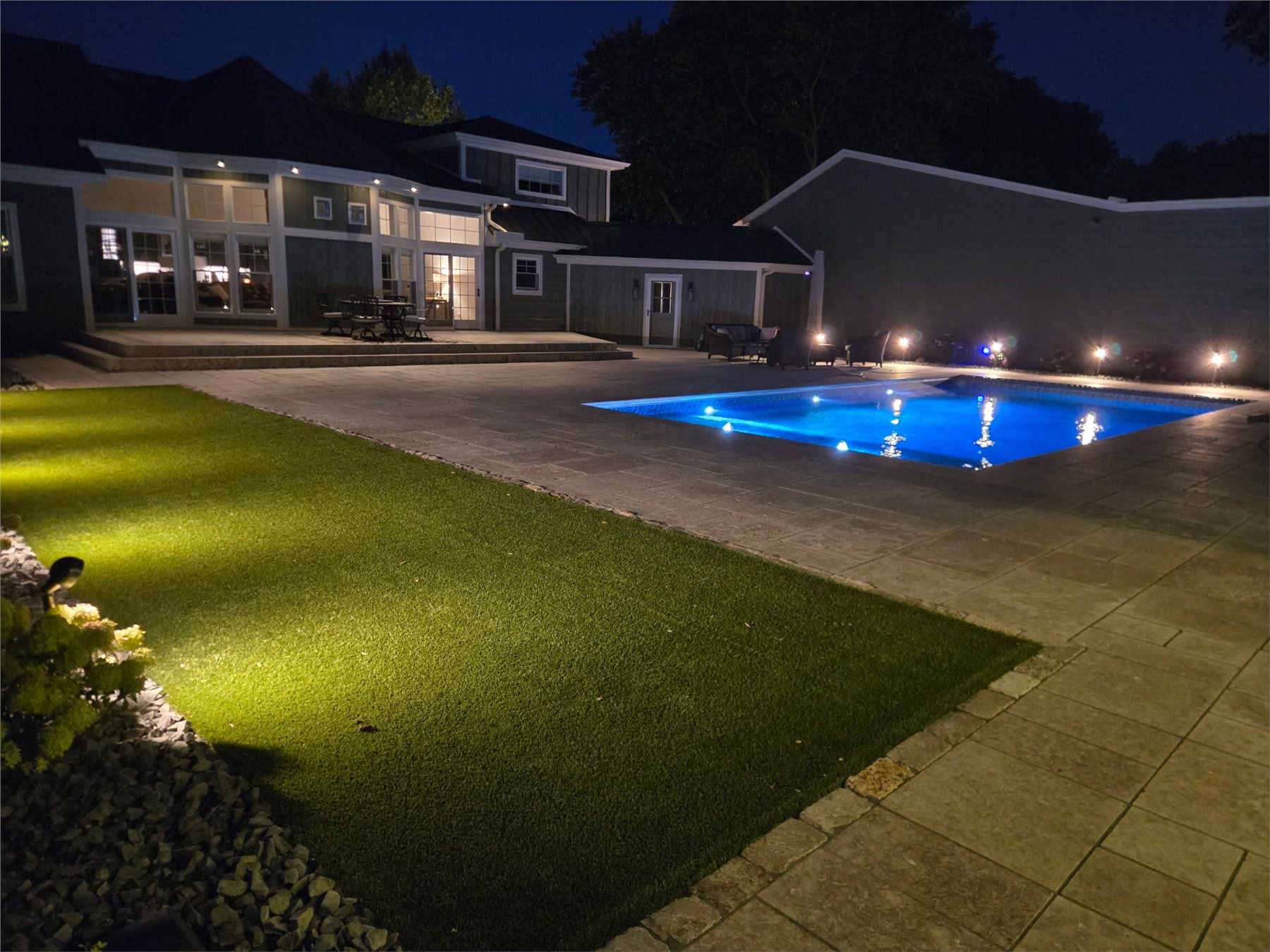 Finished Einstein pool and landscaped backyard at night