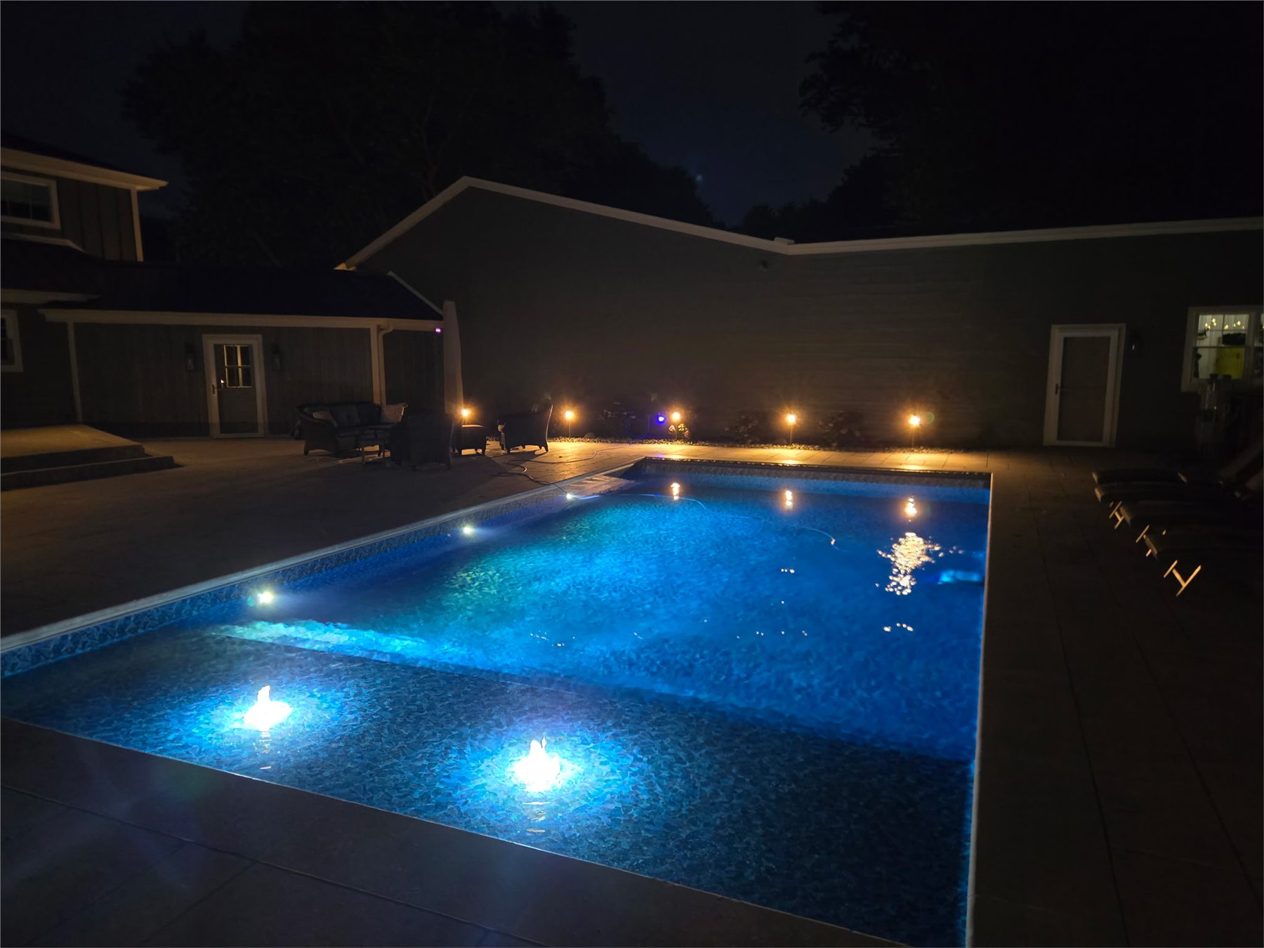 Finished Einstein pool with nighttime lighting