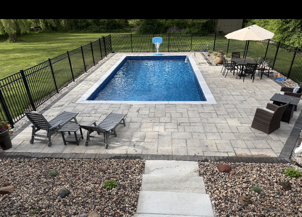 Elevated view of a finished Einstein pool and complete backyard patio